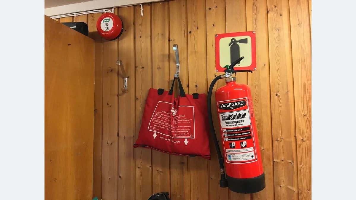 Wall-mounted extinguisher, alarm and fire blanket