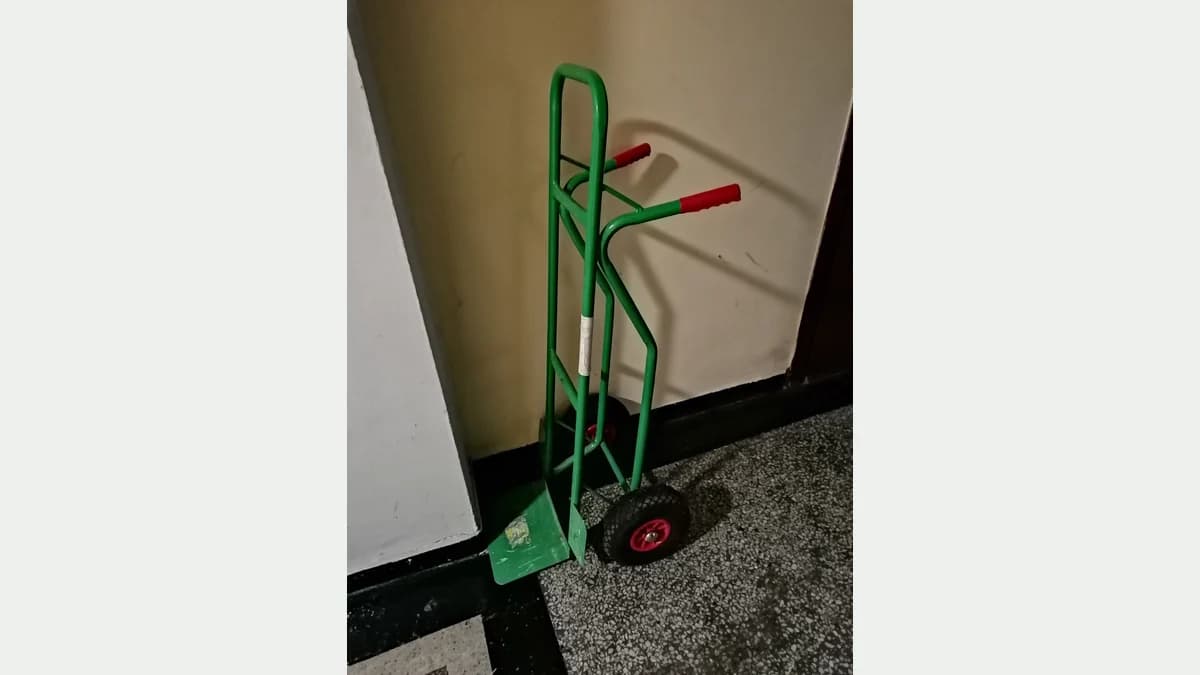 Two-wheel hand truck with handles and a load toe plate